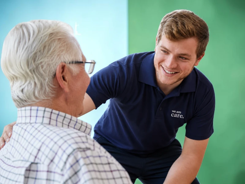 A We Are Care worker with a resident