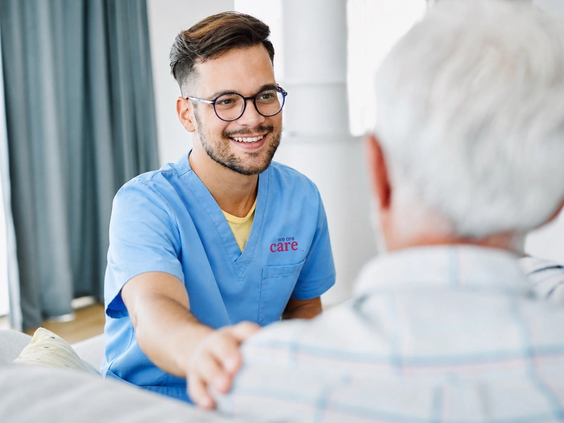 A We Are Care team member with a resident